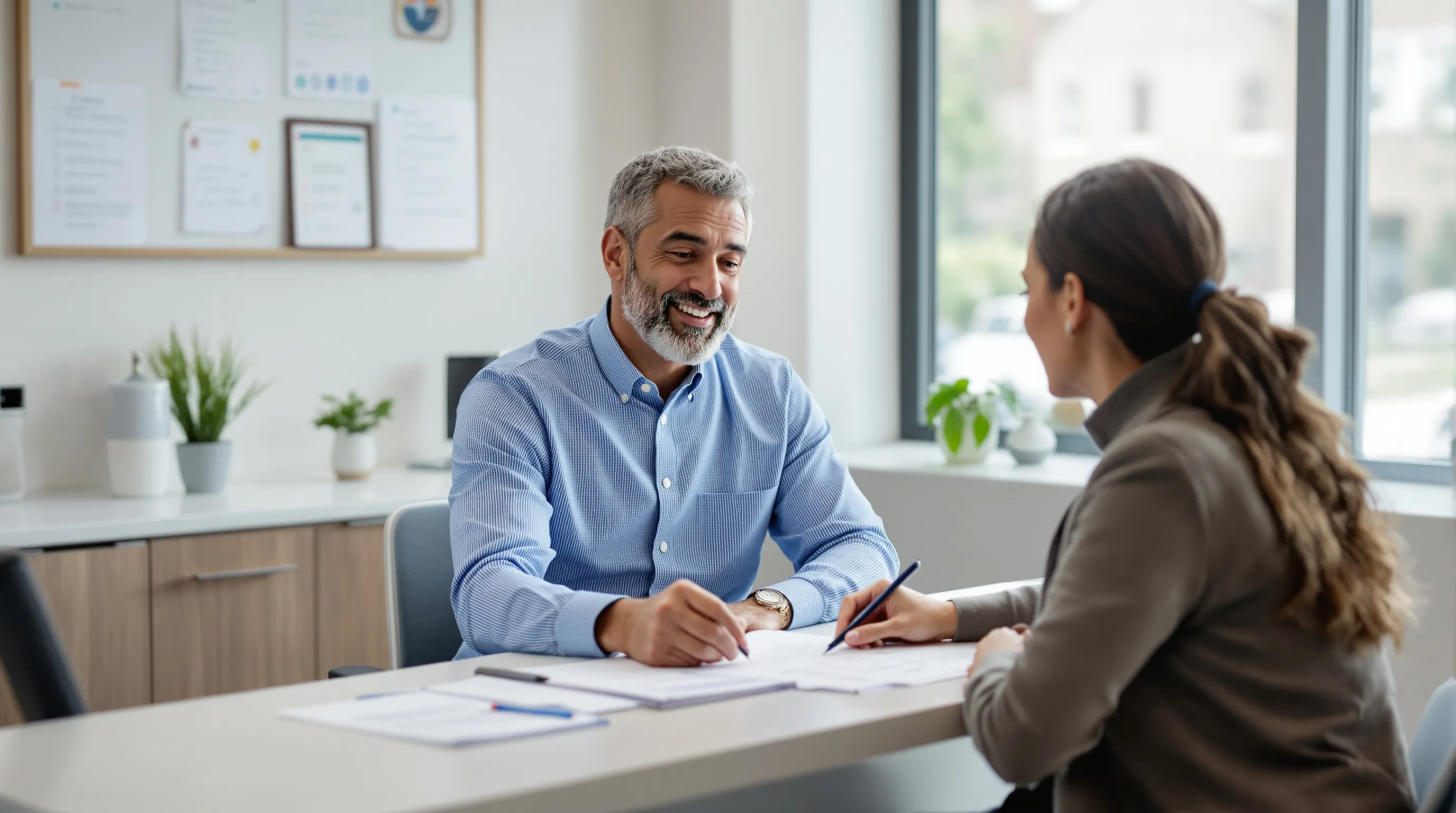 Patient and dentist reviewing credentials and a checklist together at a dental office consultation desk in New Jersey